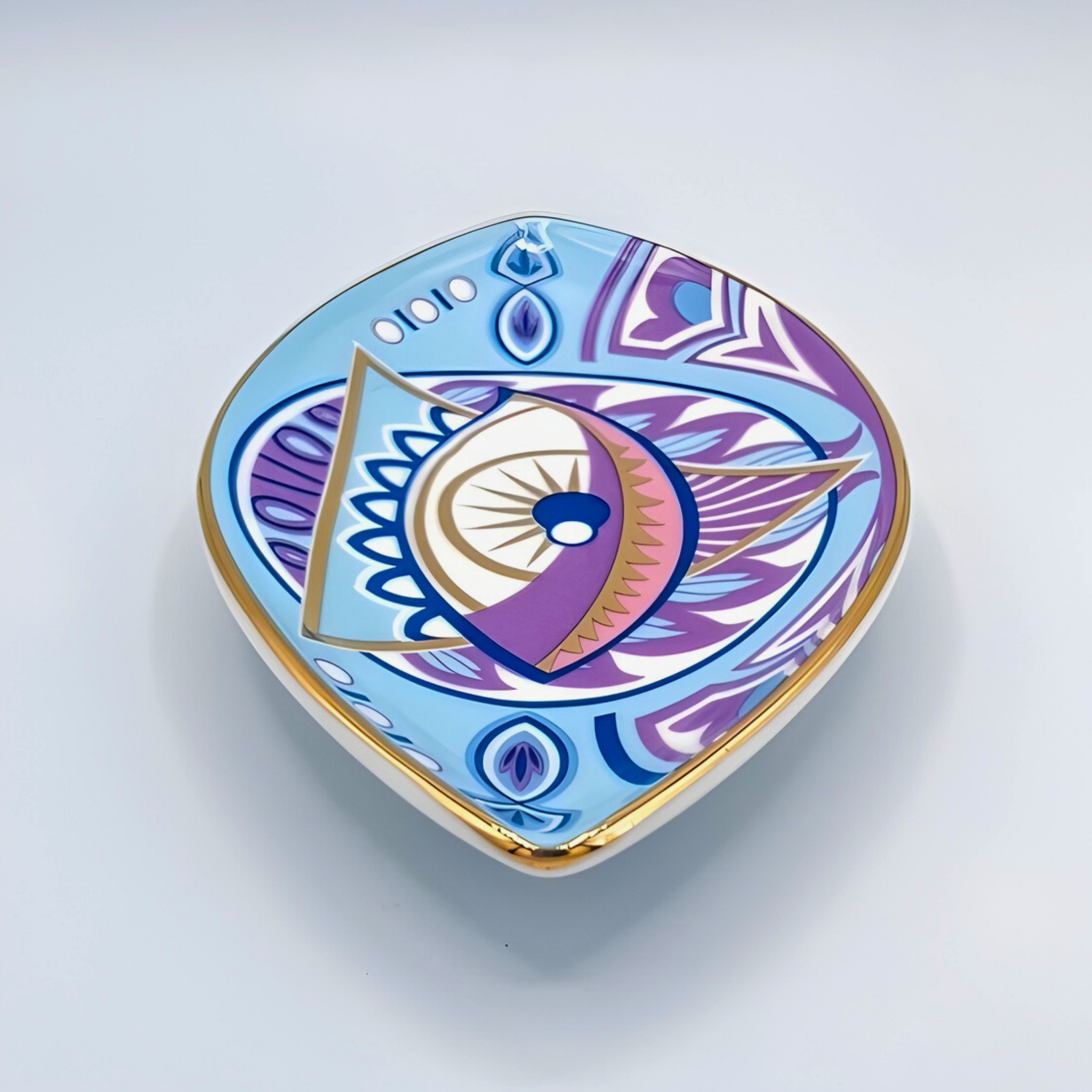 Decorative heart-shaped object with geometric design on a light gray background