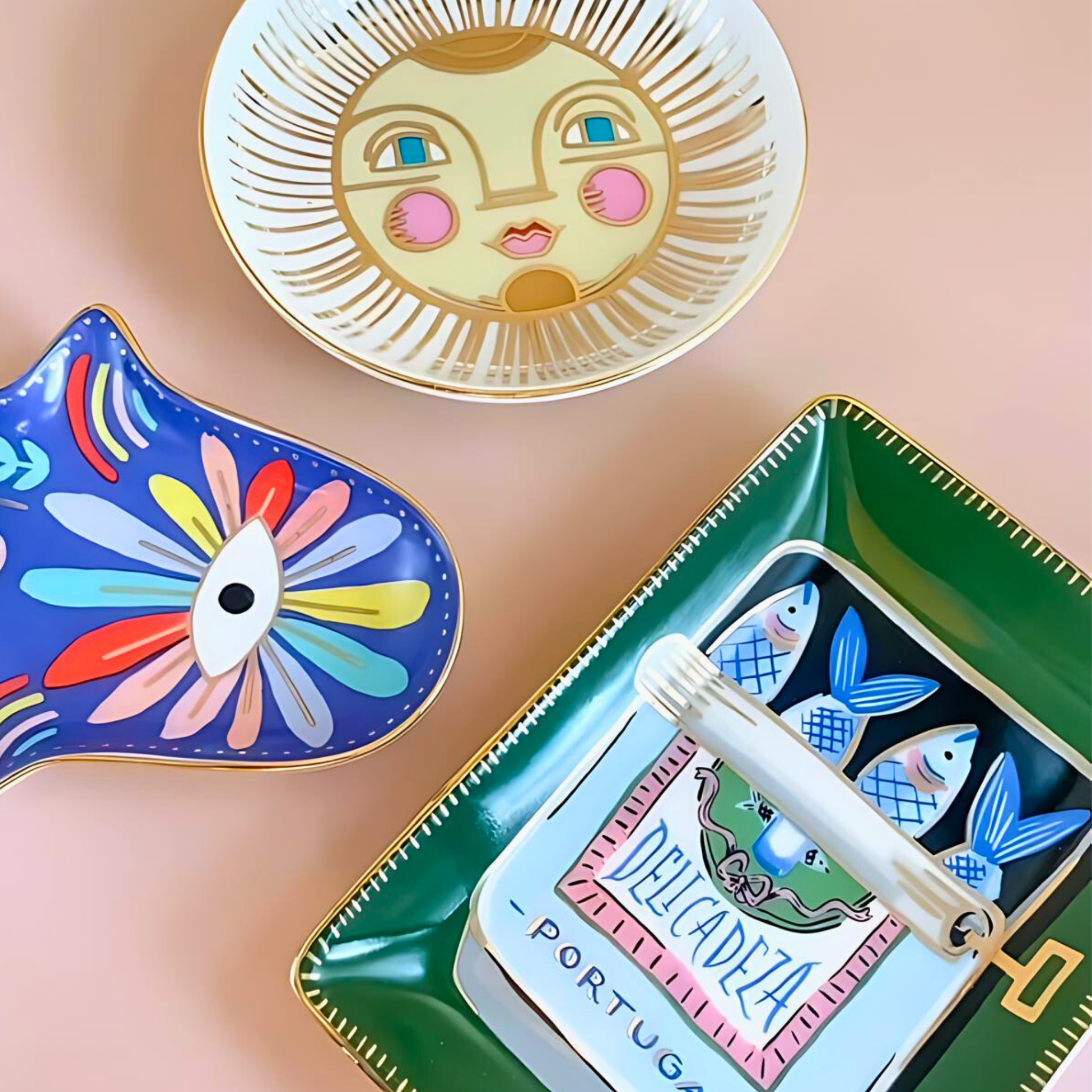 Colorful decorative plates with artistic designs on a pink background