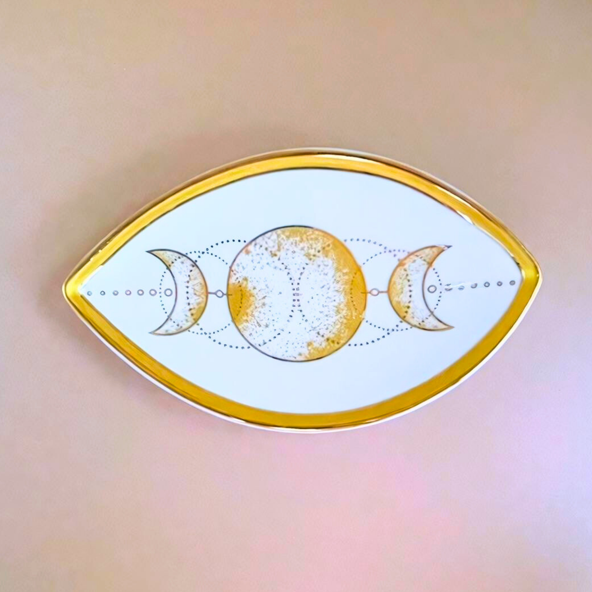 Decorative plate with moon phases design on a blurred background