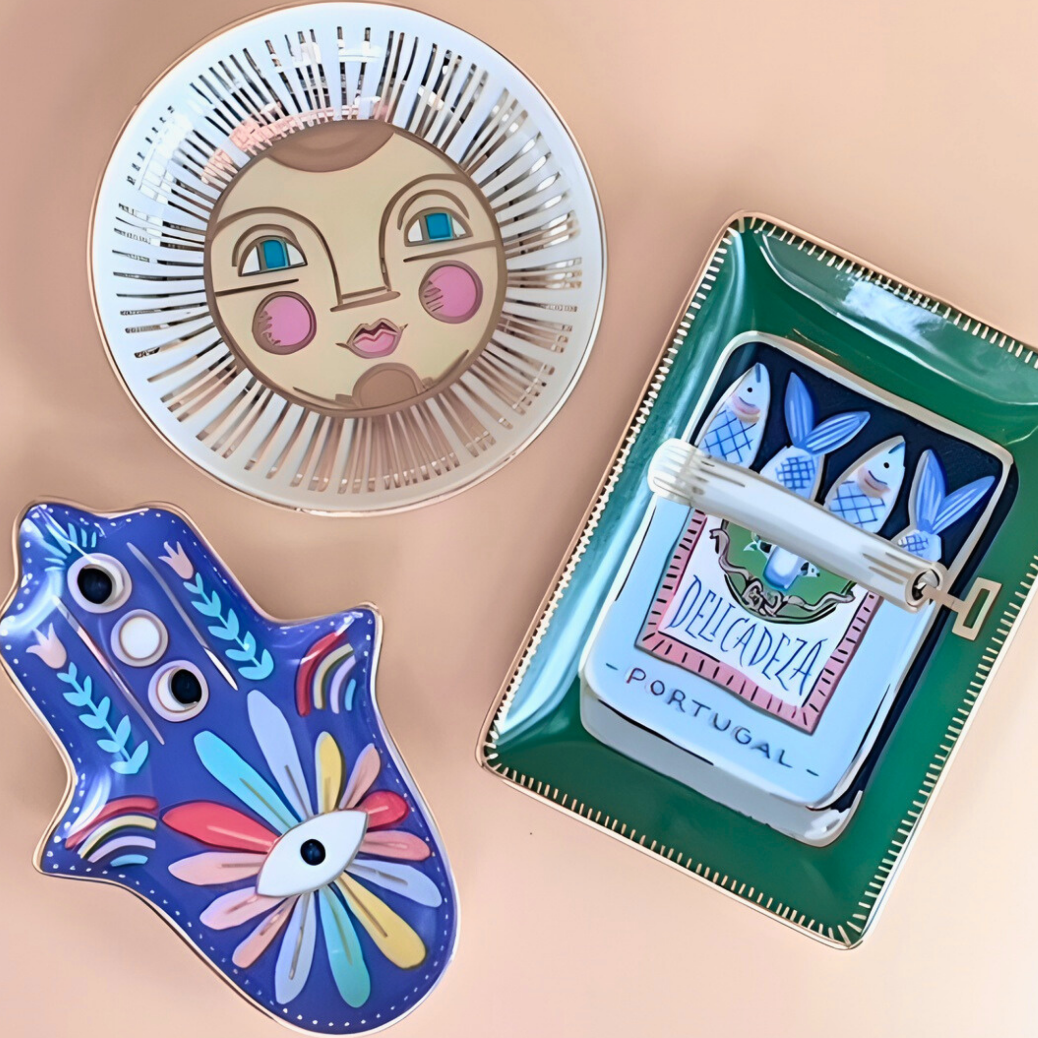 Four decorative items with artistic designs on a beige background