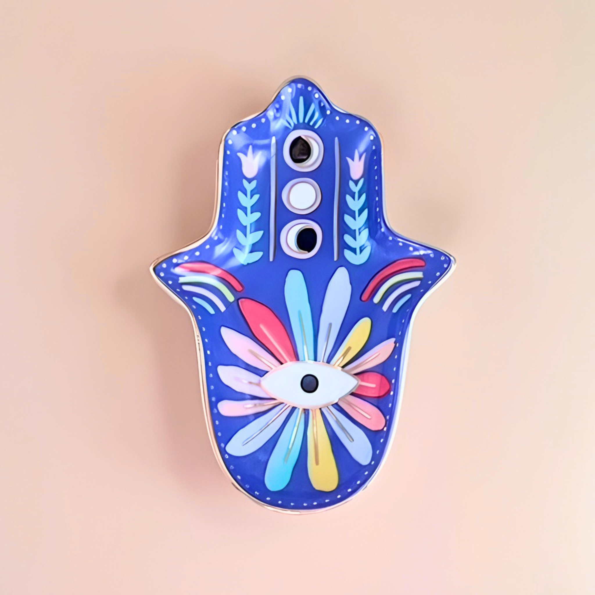 Decorative Hamsa hand with colorful patterns on a beige background