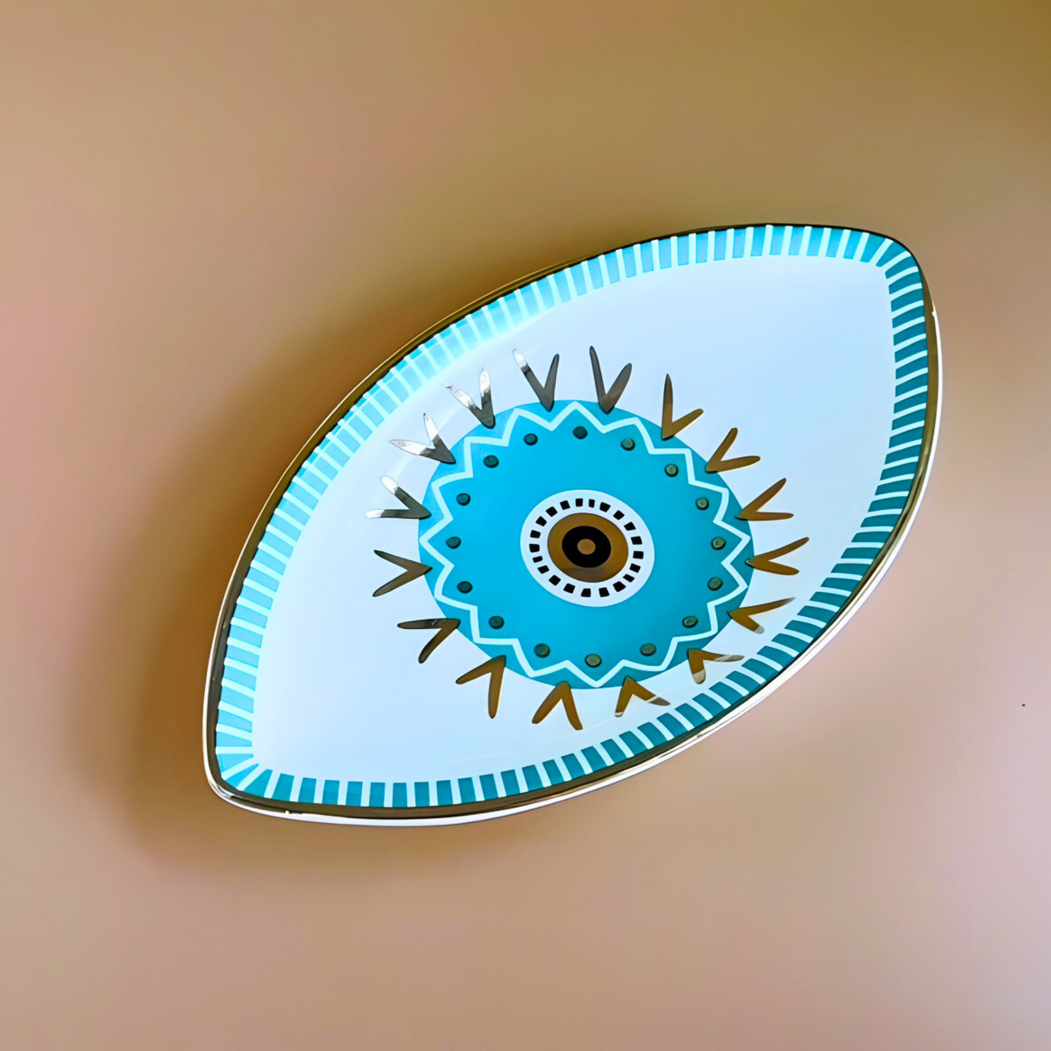 Decorative plate with blue floral design on a beige background