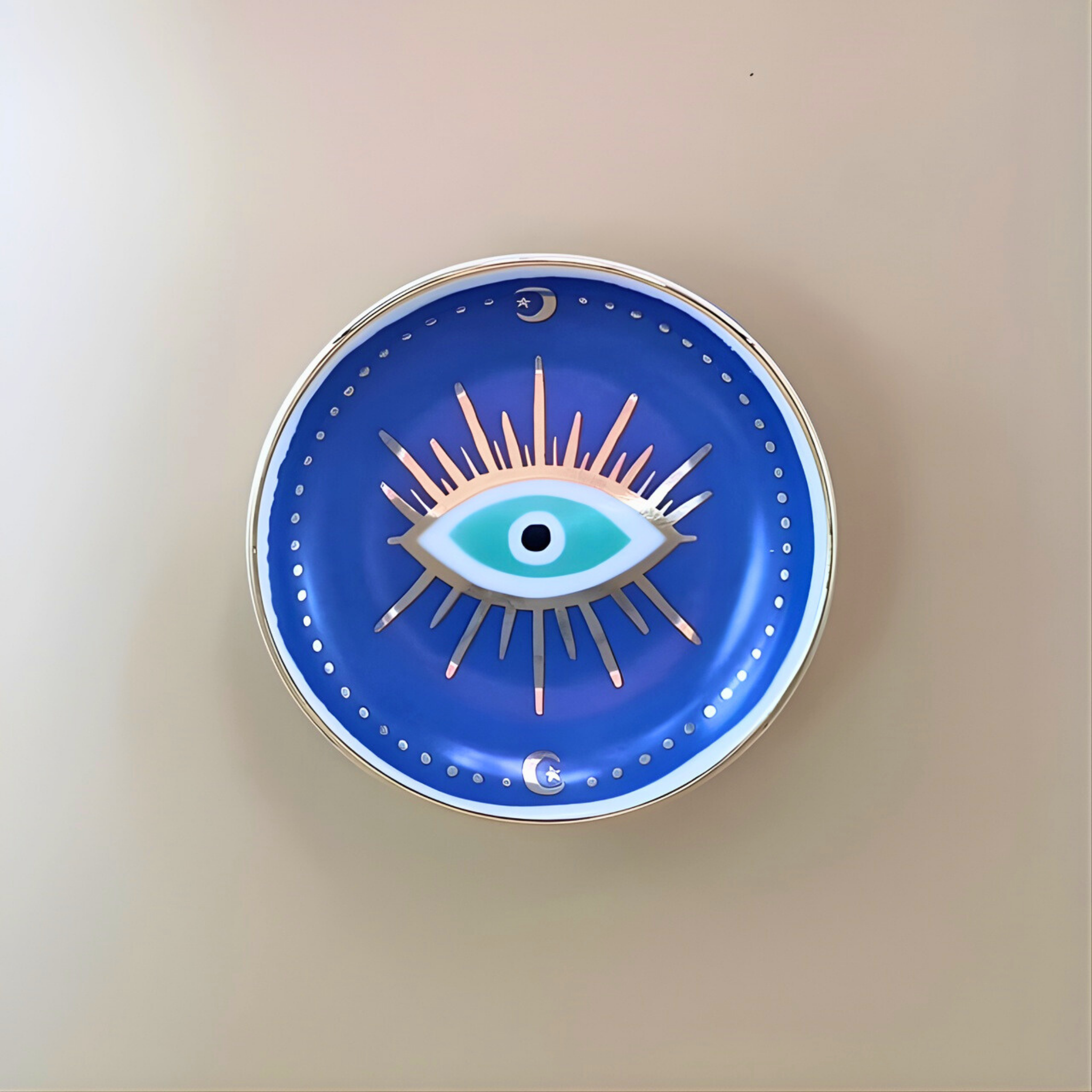 Decorative wall clock with eye design on a beige background