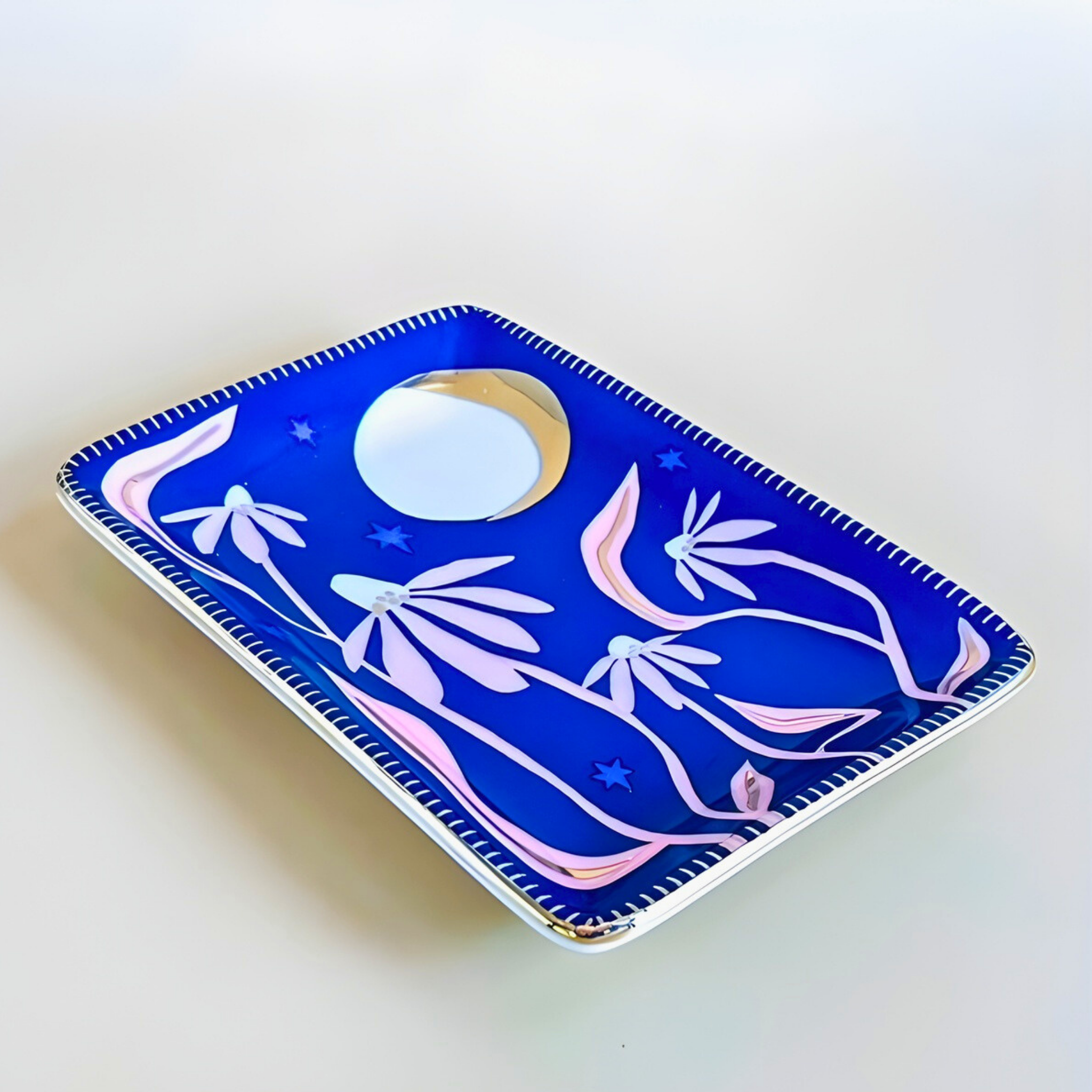 Decorative tray with floral design on a white background