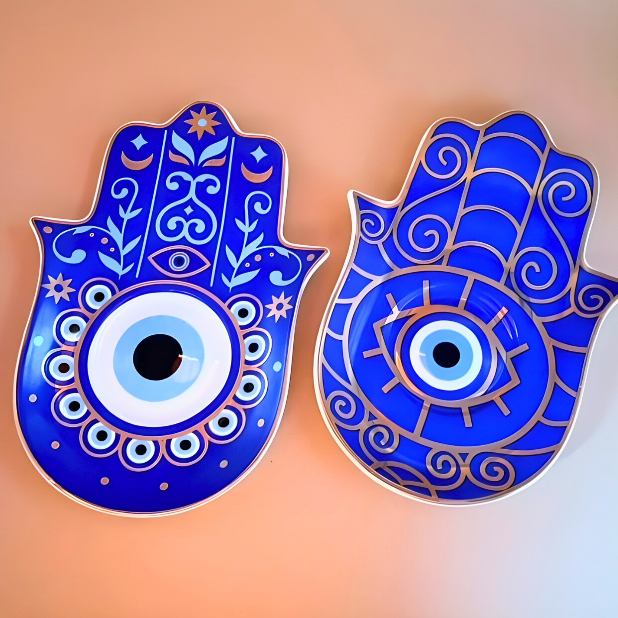 Two blue Hamsa hand wall decor pieces on a gradient background