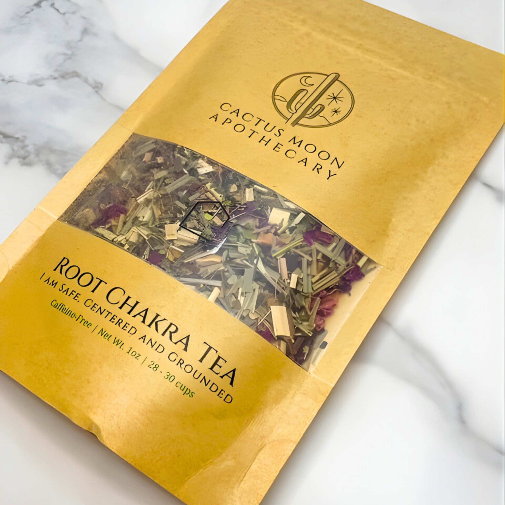 Root Chakra Tea package from Cactus Moon Apothecary on a marble background