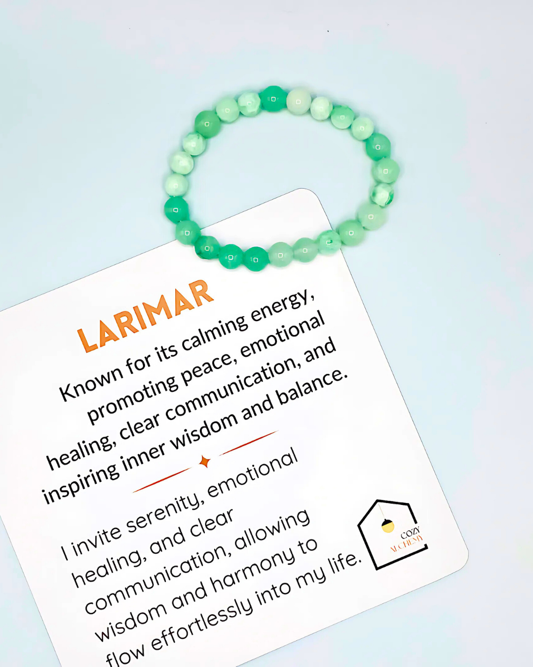 Green beaded bracelet on a card with LARIMAR branding and description