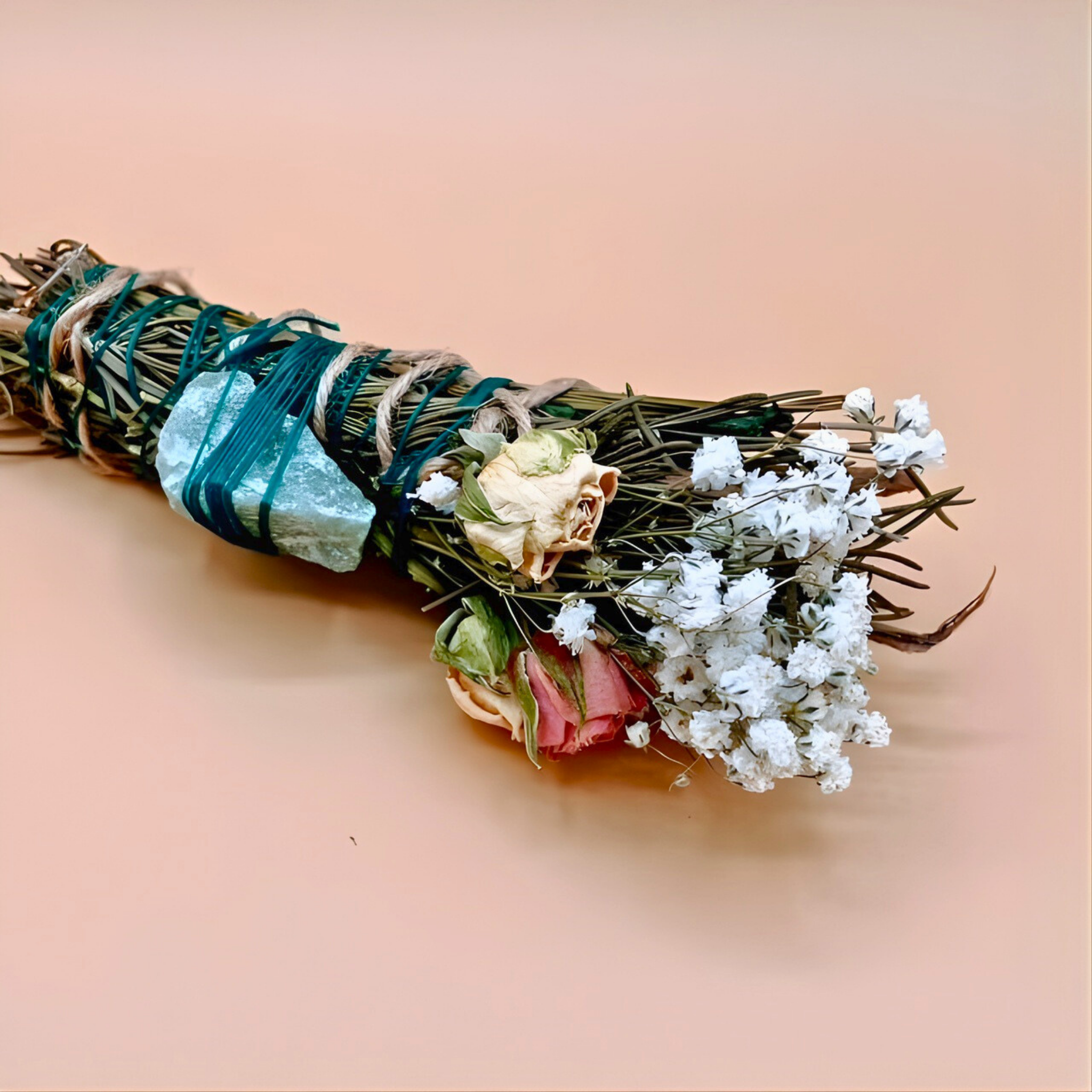 Bouquet of flowers with greenery and crystals on a beige background