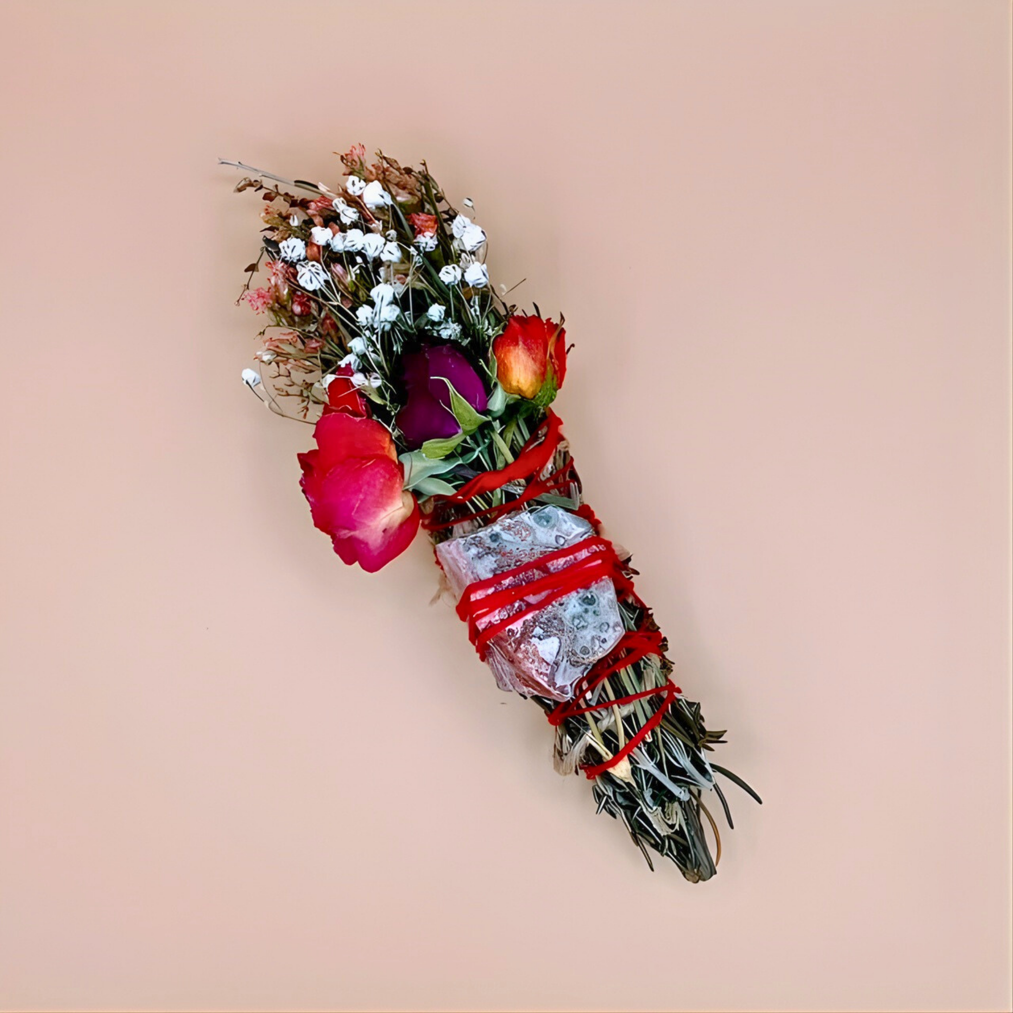 Bouquet of flowers with red ribbons on a beige background