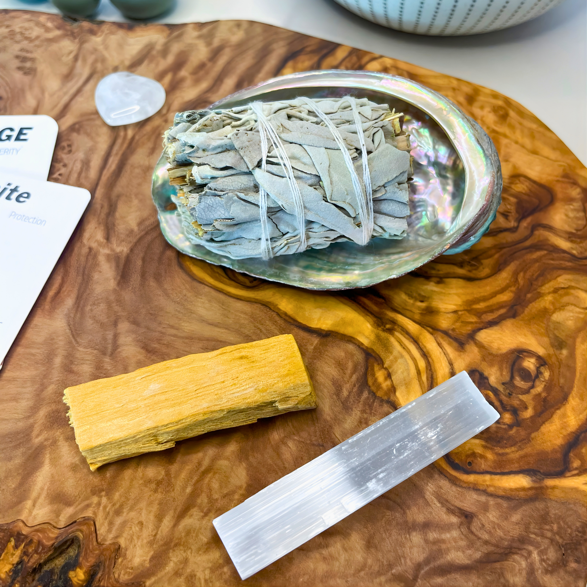 Incense sticks and a crystal on a wooden surface