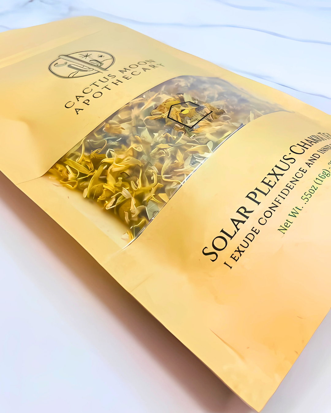 Yellow package with dried herbs and text on a white background