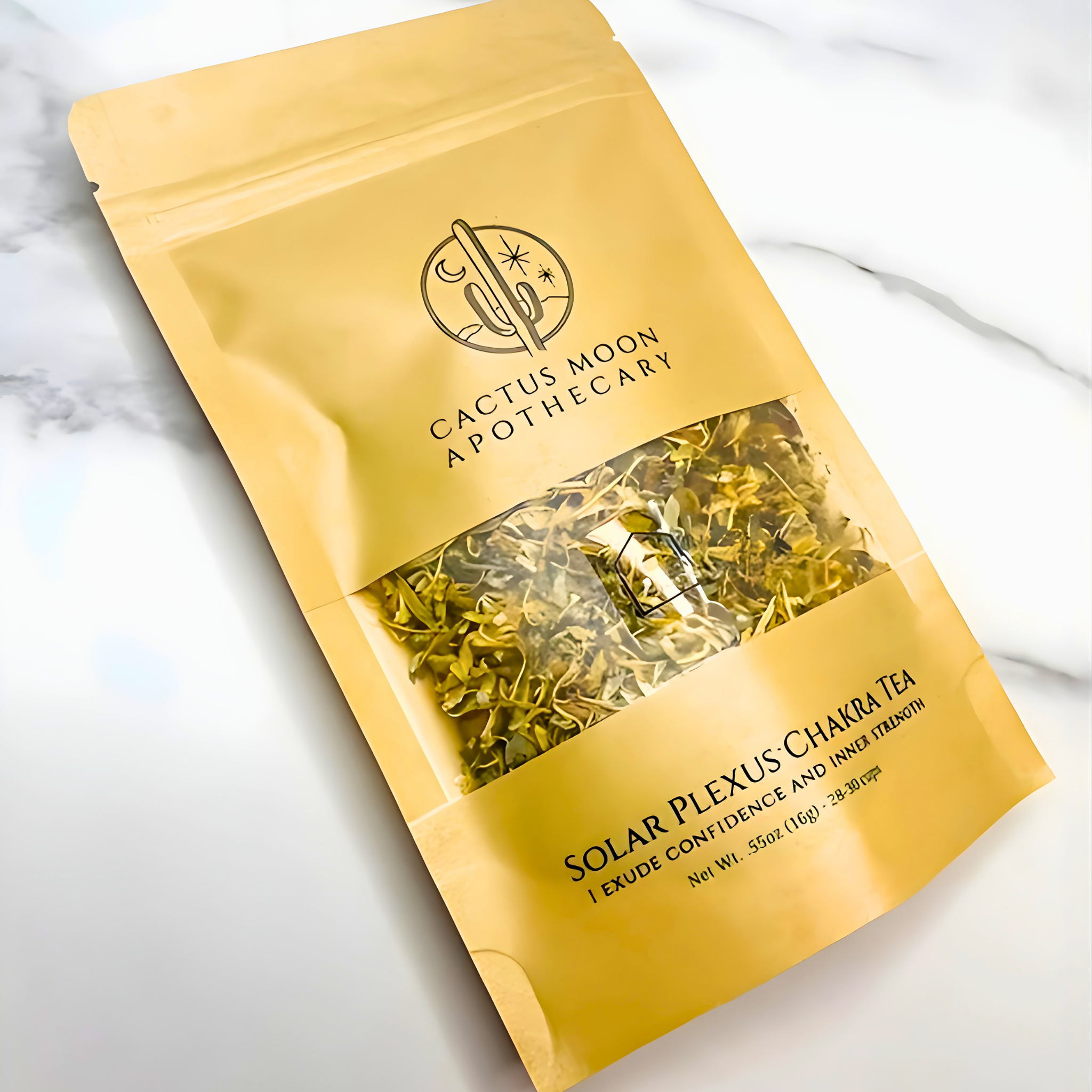 Yellow package of Cactus Moon Apothecary Solar Plexus Chakra Tea on a marble surface