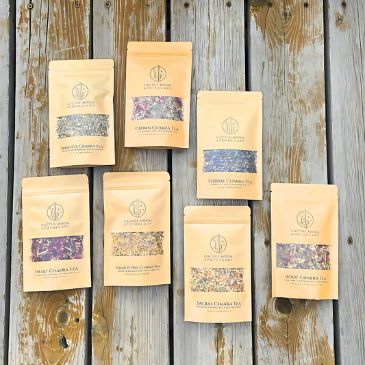 Set of Chakra tea packages on a wooden surface