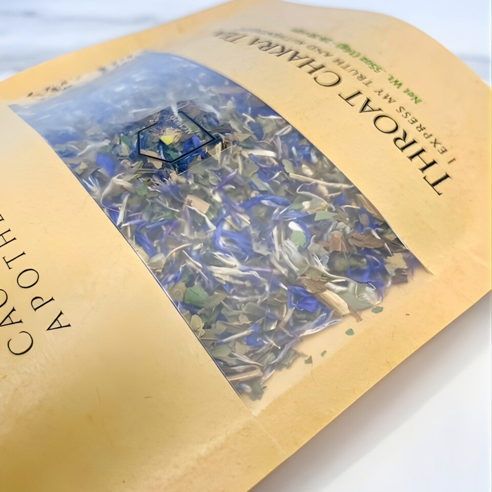 Herbal incense packaging with visible herbs inside on a white background