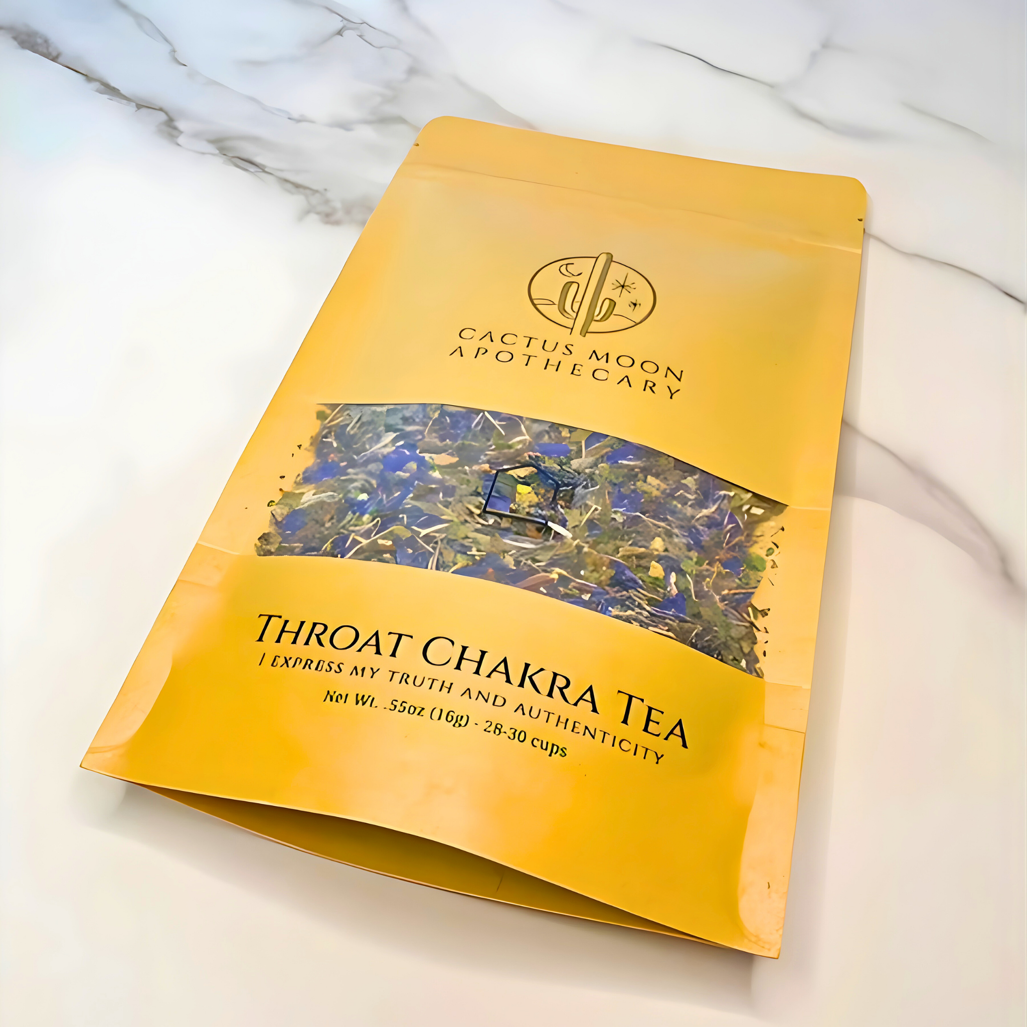 Yellow package of Throat Chakra Tea from Cactus Moon Apothecary on a marble surface