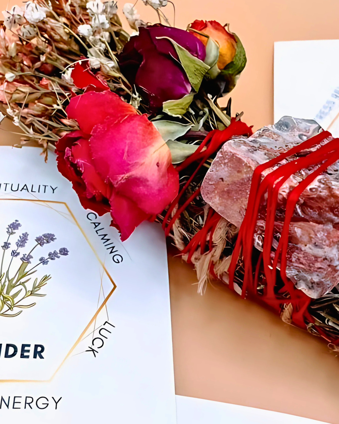 Bouquet of flowers with red ribbons on a beige background