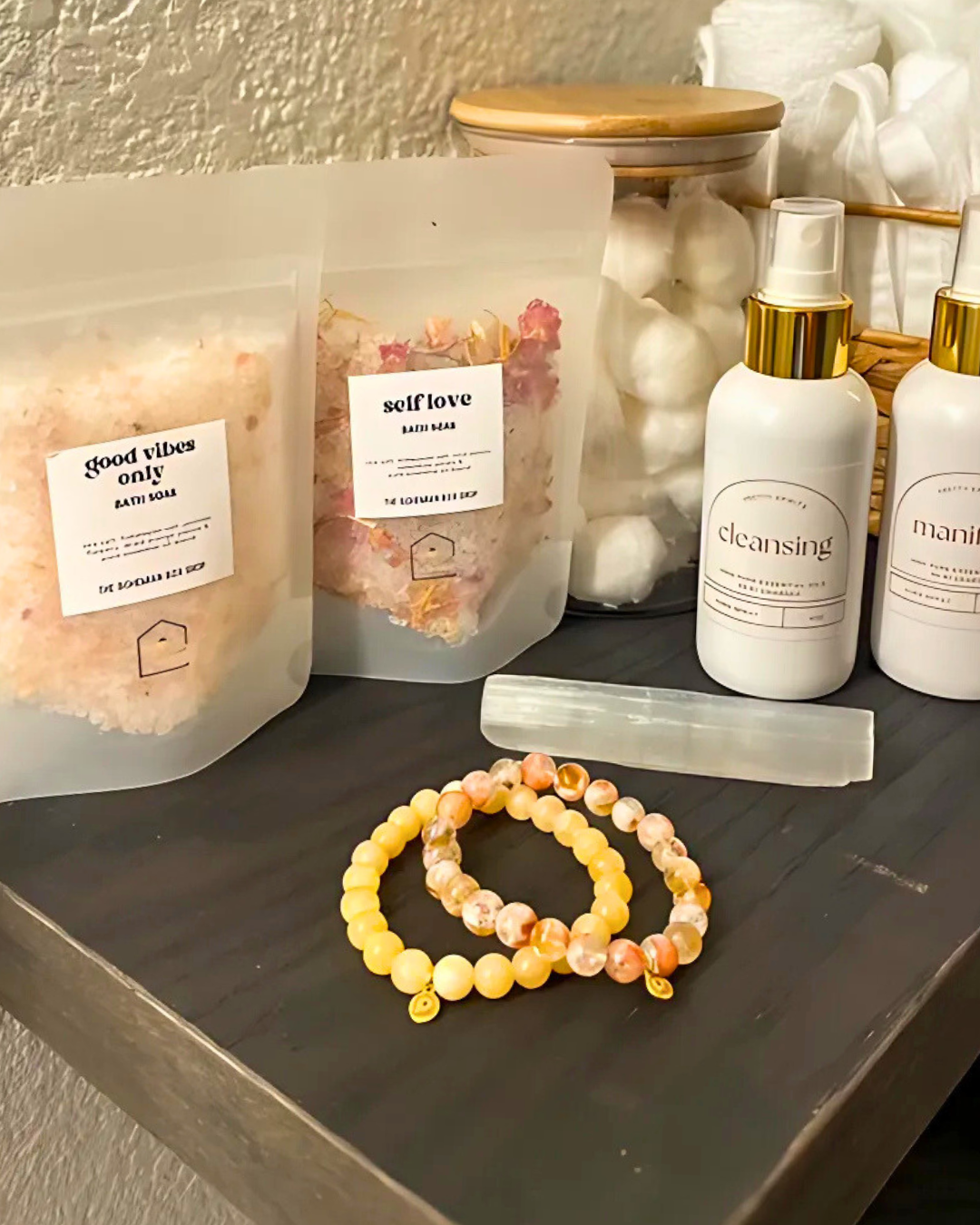 Bath bombs, skincare products, and bracelets on a shelf.